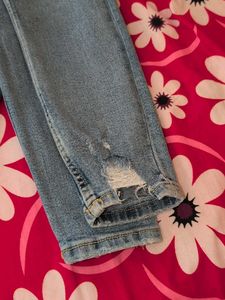 Distressed Light Wash Denim Jeans