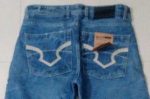 Distressed Blue Denim Jeans