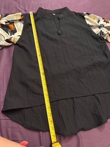 Unique Black Blouse with Patterned Sleeves