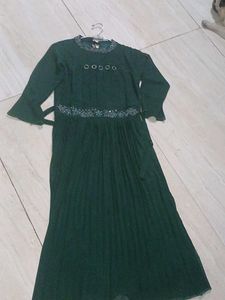a green color gown having  modern look