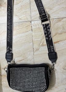 Black bedazzled sling bag in perfect condition