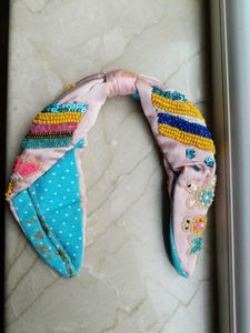 Pink Hairband With Motifs.
