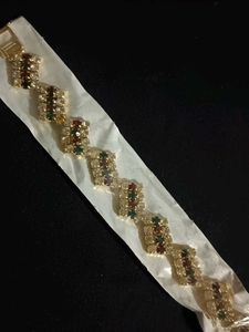 Elegant Gold Finish Bracelet with Multicolour Ston