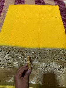 Elegant Yellow Art Silk Saree With A Classy Bangle