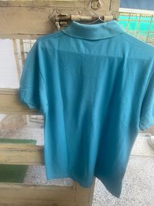 Brand New T Shirt Sky blue colour with red colour, print on right arm