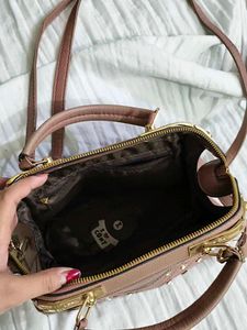 Cute mauve satchel with gems