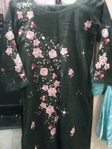 dark green kurti and pant set.