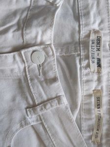 White Mid Raise Skinny Jeans