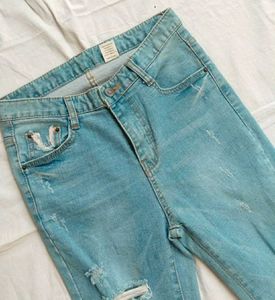 Ripped Fringe Hem Flare Jeans