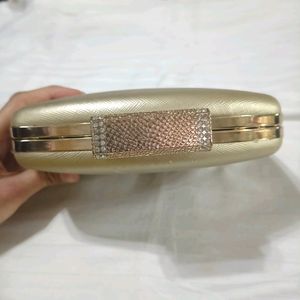 Golden Clutch Bag With Chain Sling Attachment