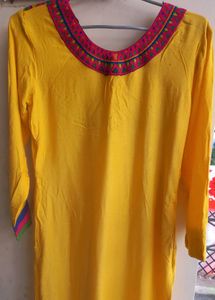 Yellow Kurti With Multicolor Embroidered Yoke