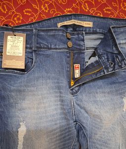 Women&#39;s Blue Rigged/Distressed Jeans