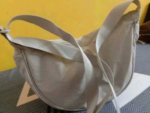 Cream-colored Slingbags