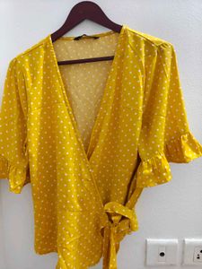 Harpa Yellow polka wrap top