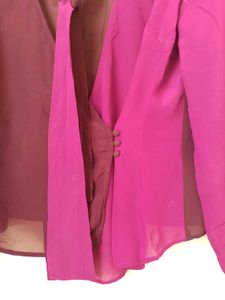 Branded two- tone wrap top.