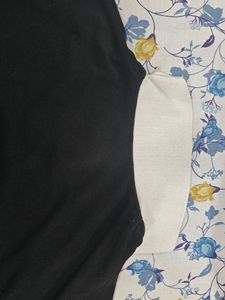 This is a black polo tshirt.With white collar.