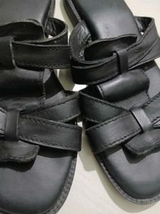 Black leather slides