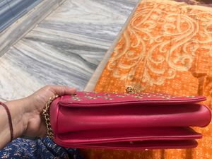 Red Grommet Chain Bag