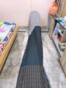 Green,red,black and white standard saree.
