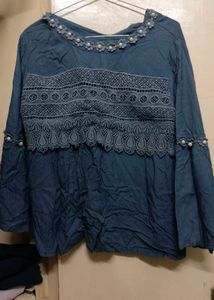 A Dark Grey Top With Beads