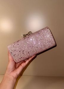 rose‑gold glitter box clutch with bow clasp, chain