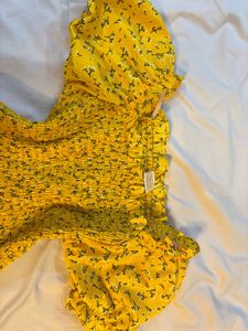 Yellow Floral Smocked Top.NEW WITHOUT PRICE TAG