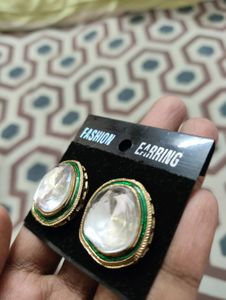 White Stud With Green And Golden Border