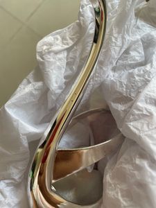 Product: Swan desert spoon stand. Material: Nickle