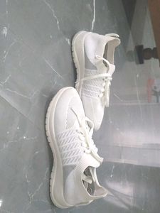 white sneakers.