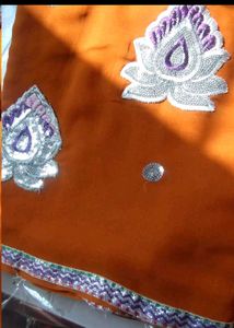 Elegant Orange Saree with Silver Embroidery