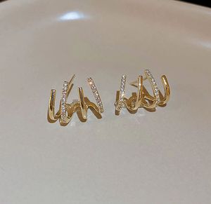 Gold Claw Crawler Earrings
