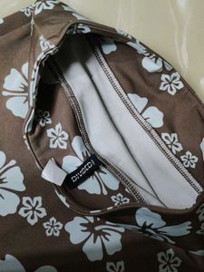 A beautiful brown miniskirt skirt with blue floral