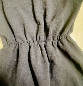 Chic Black Dress with Polka Dot Sleeves