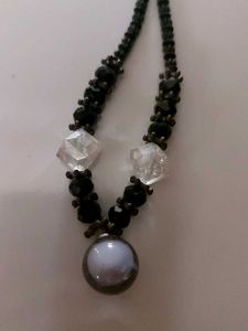 The necklace in th