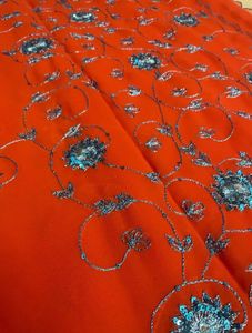 Orange Saree With Blue Shiny Embroidery