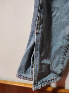 Blue Straight Leg Jeans With A Cut