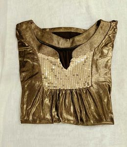Fringed Brown  leather Skirt golden top combo.