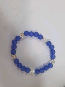 Blue Beaded Bracelet with Silver Flowers