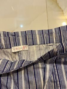 combo of white ribbed shirt and cotton shorts