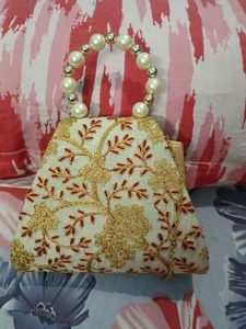 Small Clutch With Stone And Golden Embroidery Work