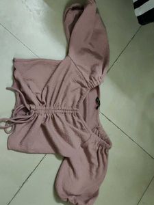 A Pink Crop Top With Pullup Strings In The Size M