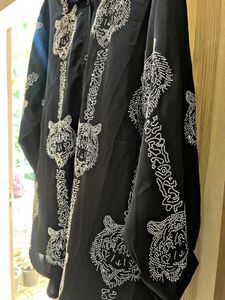 black oversized button-up shirt.