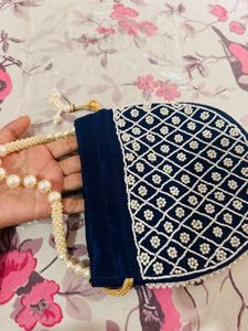 Elegant Heavy Blue Pearl Potli Bag with Tassels