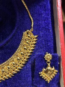 Artificia Gold Necklace And Earrings