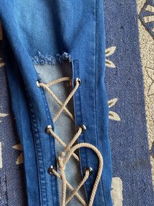 Distressed Lace-Up Jeans
