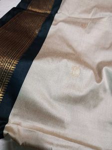 Beige Colour Saree With black &amp; Golden Border.