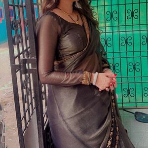 Elegant Bronze Sari with Intricate Gold Border