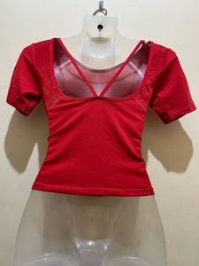 top features a V-shaped strap design at the back