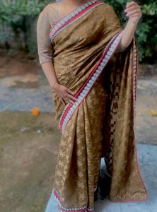 Elegant Brown Saree with Red Border