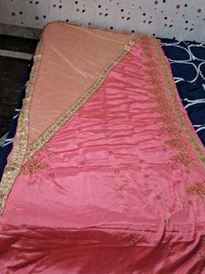 It Is Pink Color Georget With Golden Net Border .